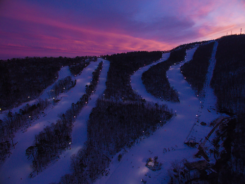 View of the ski resort in Massanutten, Virginia, showcasing a winter sports scene with a ski lift and snow-covered slopes, offering a captivating winter scenery.