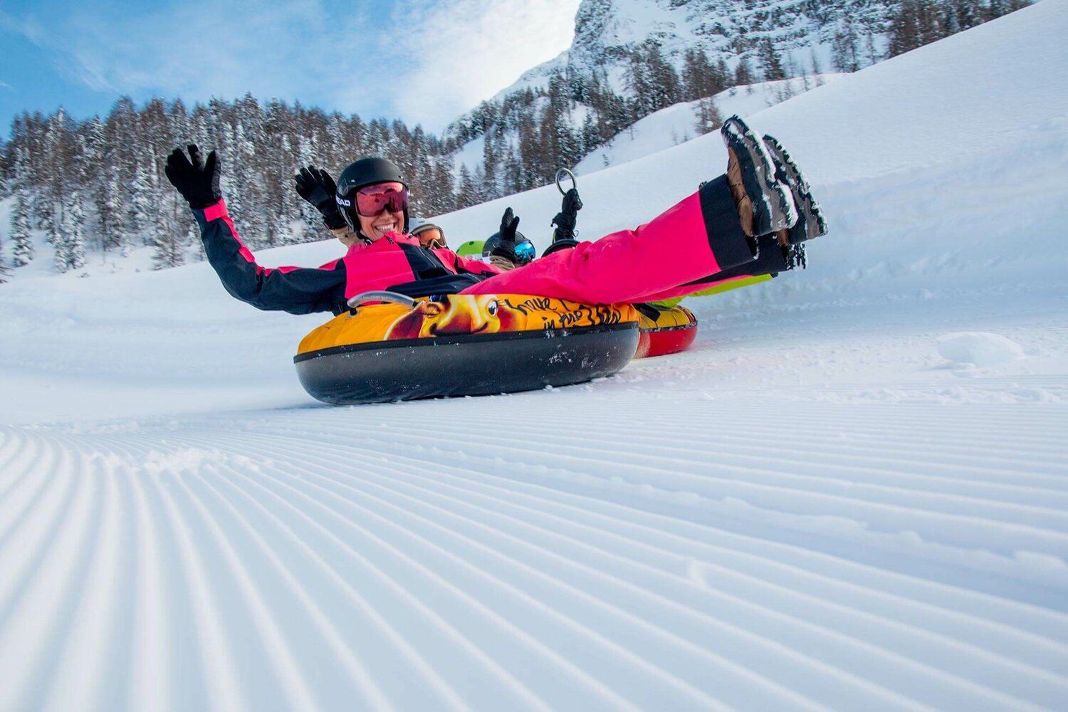 Gerlosstein in Austria - a person on a snow tube in the snow.