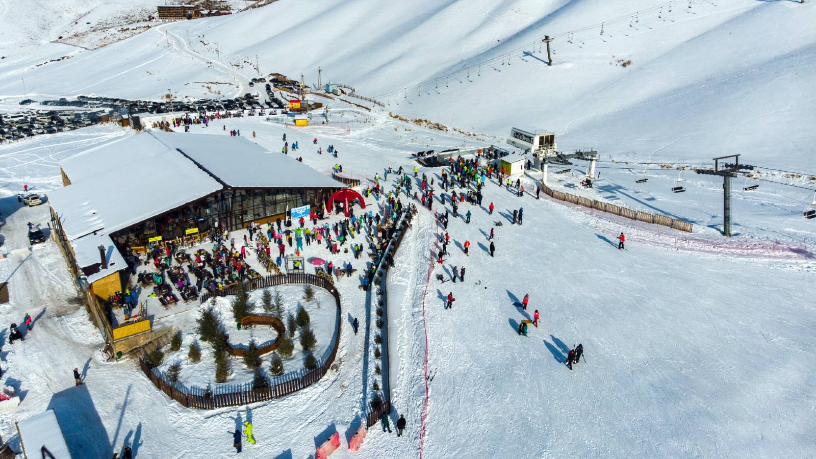 Chunkurchak in Kyrgyzstan - a group of people skiing down a snowy slope.