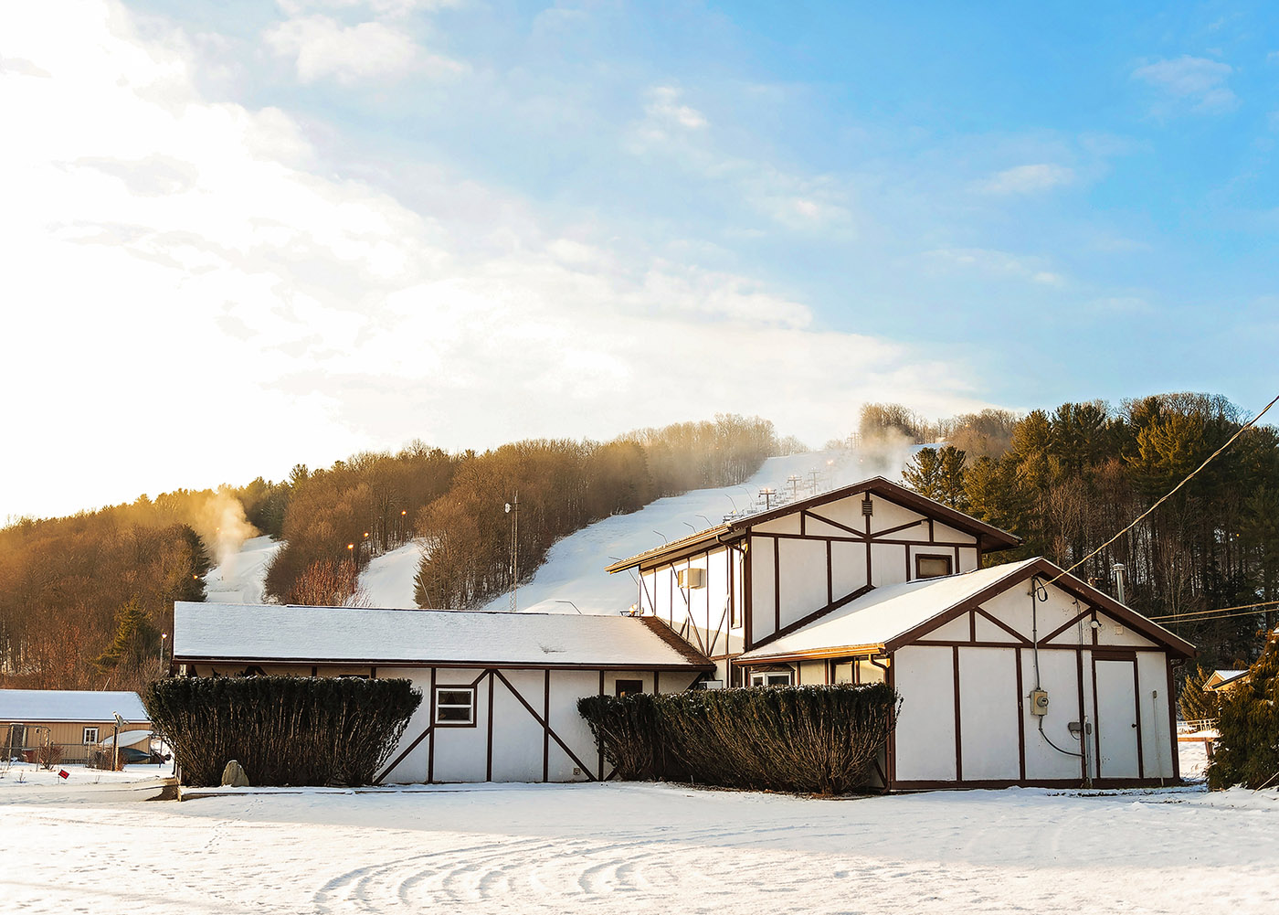 Swain in USA - a house in the snow on a sunny day.