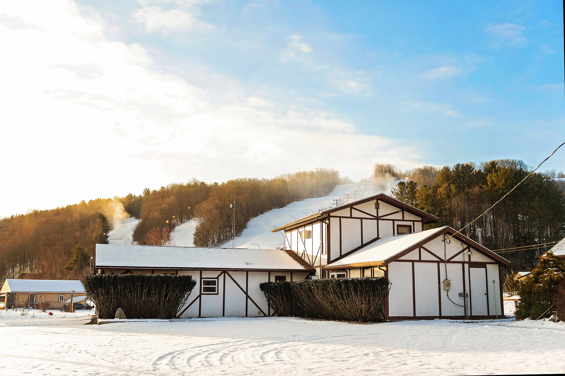 A vibrant winter sports scene at Swain Resort in New York USA. Skiers enjoying the pristine snow-covered slopes amidst beautiful winter scenery at this bustling ski resort.