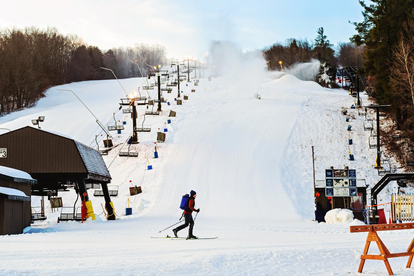 Swain in USA - a person skiing down a snow covered hill.