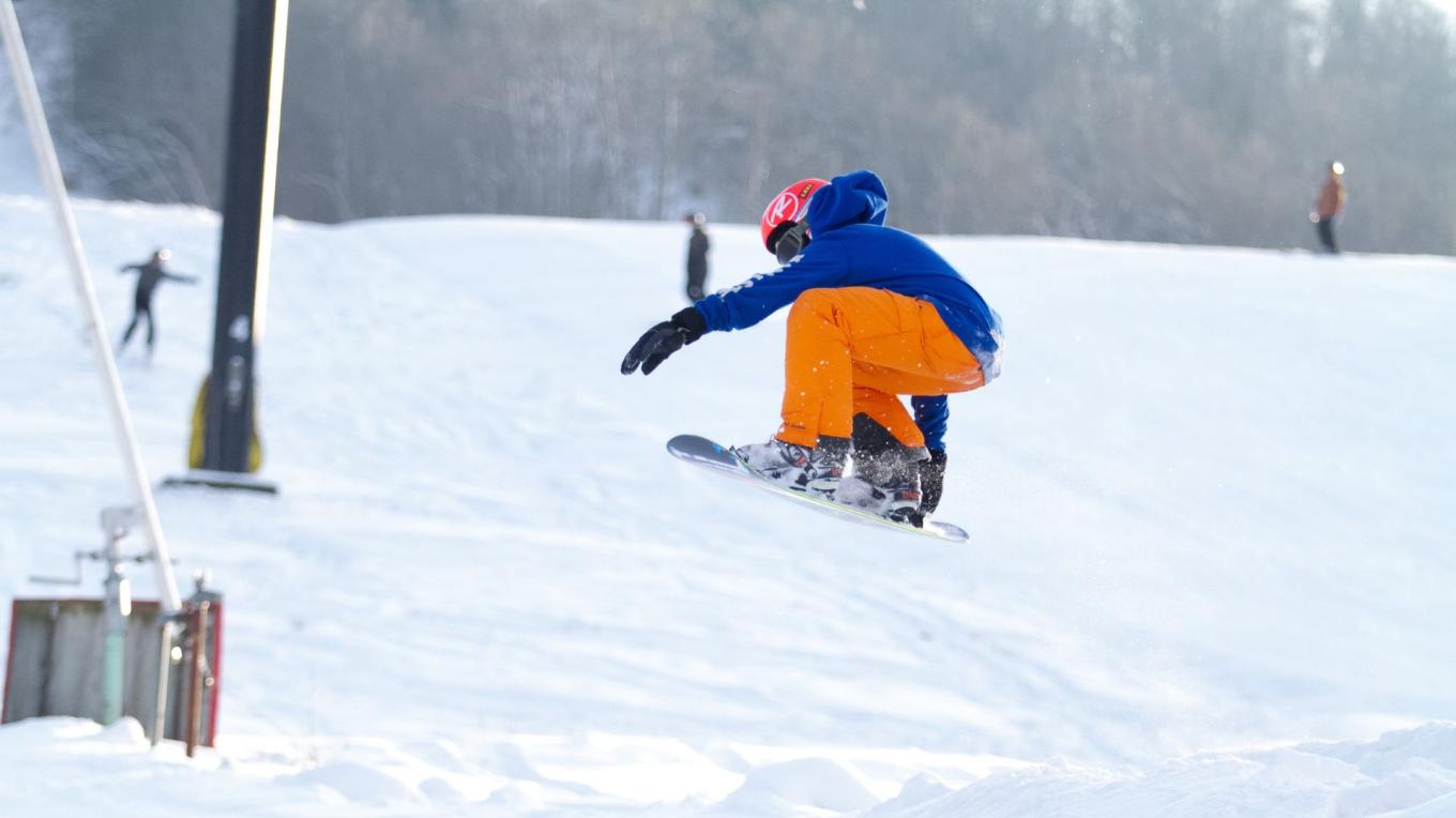 A snowboarder navigating the snowy slopes at Swain Resort in Chautauqua-Allegheny Swain New York USA.