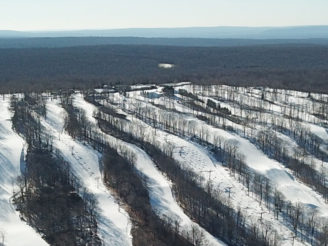 Jack Frost Mountain in USA - an aerial view of a ski slope in the mountains.