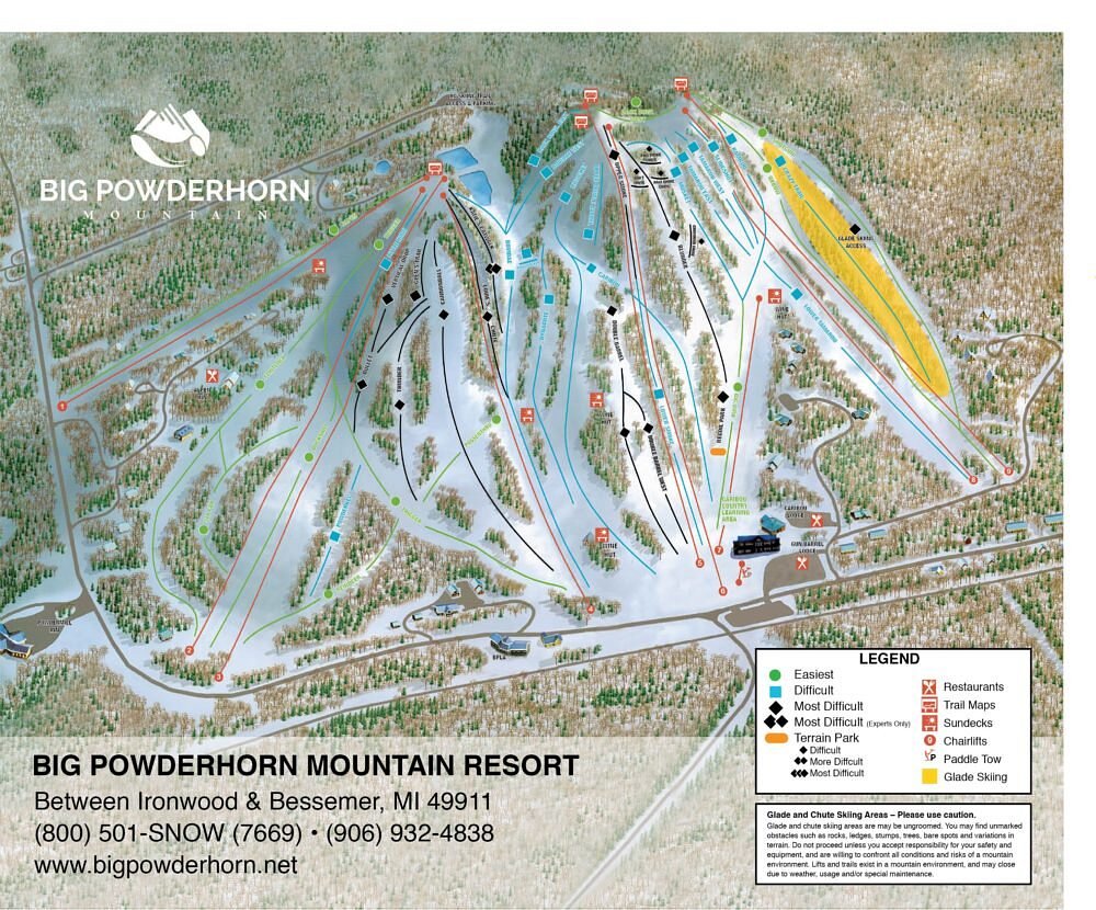 A picturesque view of Big Powderhorn Mountain ski resort in Bessemer, Michigan, blanketed in pristine snow, perfect for winter sports activities.
