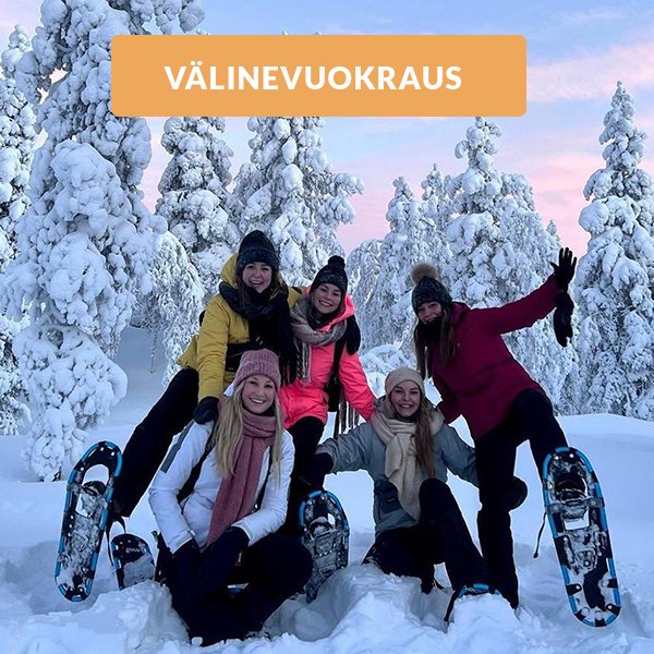 A vibrant scene in Saariselkä Lapland showing a family and other people enjoying winter sports such as skiing against the backdrop of a charming chalet.