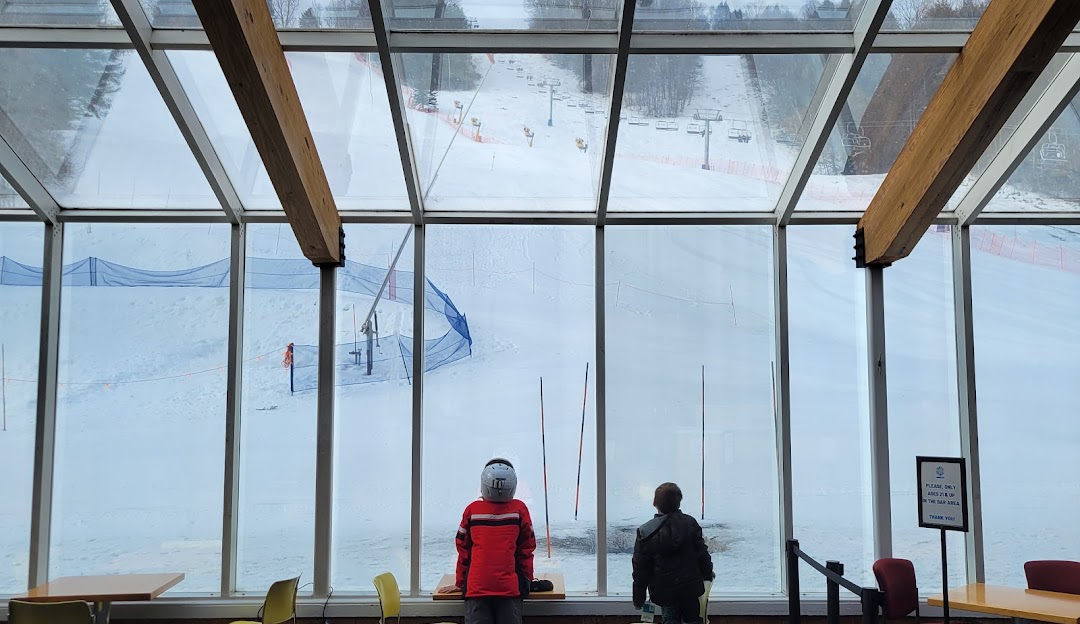 View of Saskadena Six winter sports centre in South Pomfret, Vermont, showcasing a typical winter sports scene with snowy landscapes.