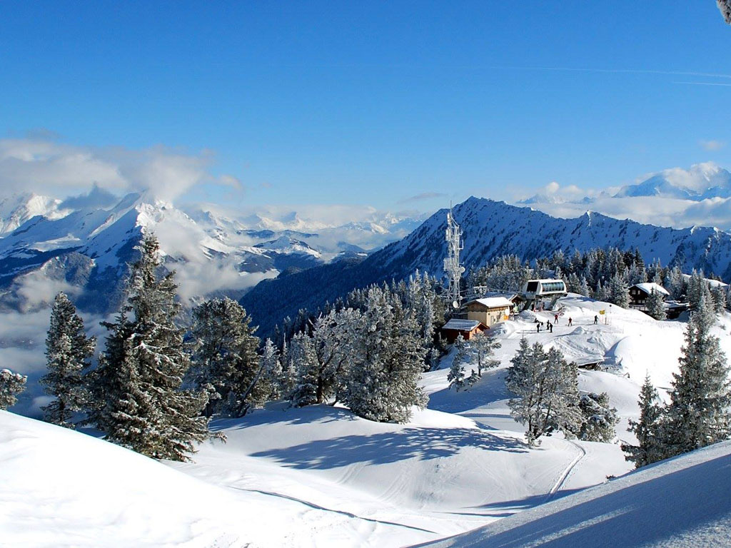 Winter sports scene at La Sambuy-Seythenex in France, featuring a charming chalet amidst breathtaking winter scenery in a bustling ski resort.