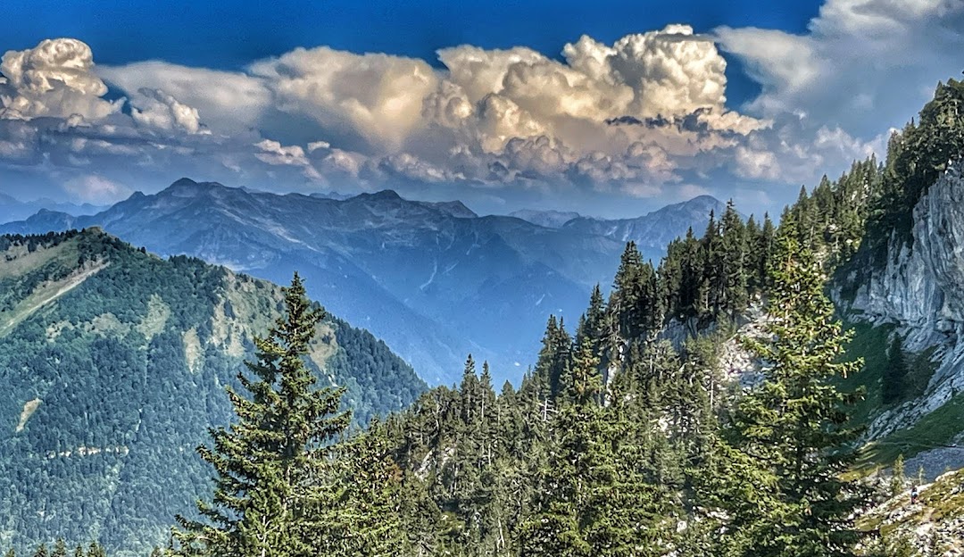 Image of the snow-covered mountain at La Sambuy-Seythenex, Faverges, France with a quaint chalet nestled among the slopes, embodying the serene ambiance of a ski resort.