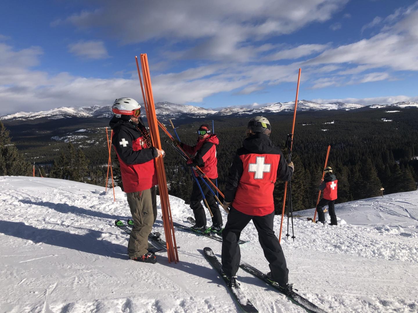 Meadowlark Ski Lodge in USA - a group of people standing on top of a mountain.
