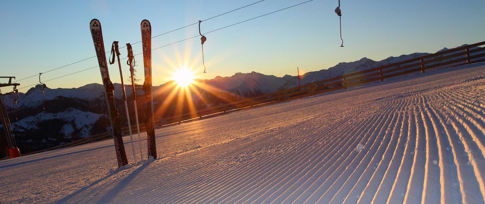 A skier enjoying a day at Großarltal-Dorfgastein ski resort in Pongau, Salzburg, Austria. The scene captures beautiful winter scenery with a ski lift in operation.