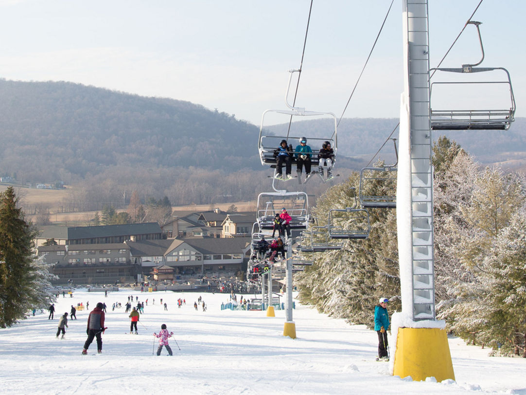 Liberty Mountain in USA - a ski lift going up a snowy hill.