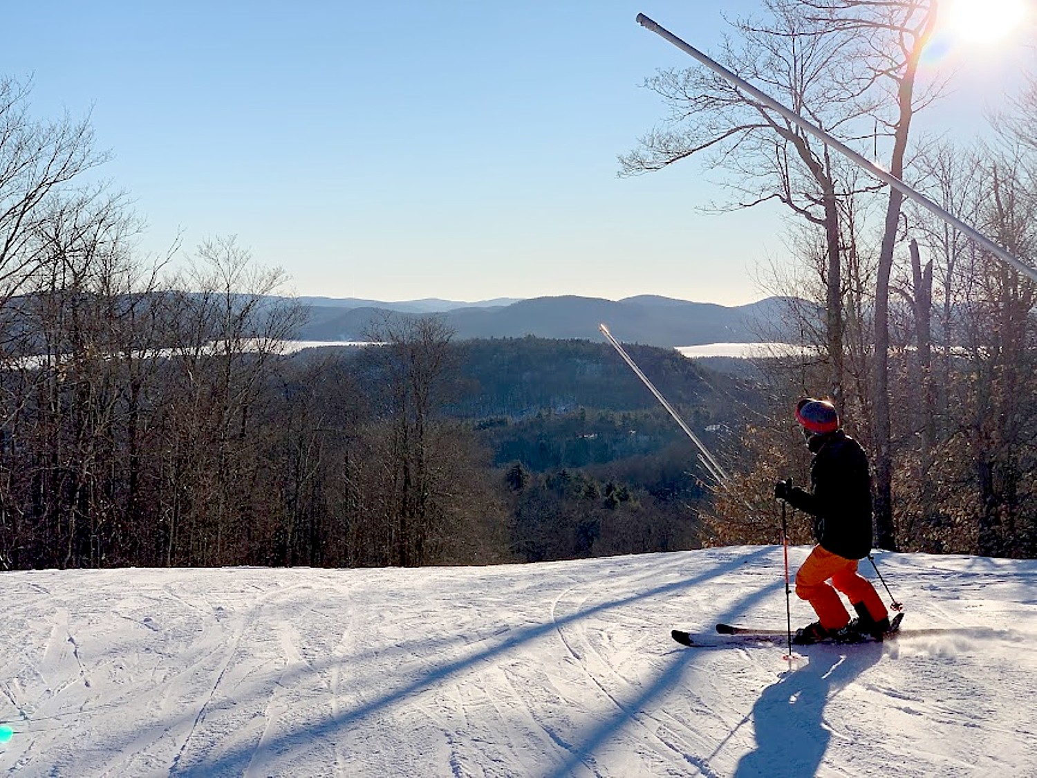 Oak Mountain in USA - a person skiing down a hill on a sunny day.