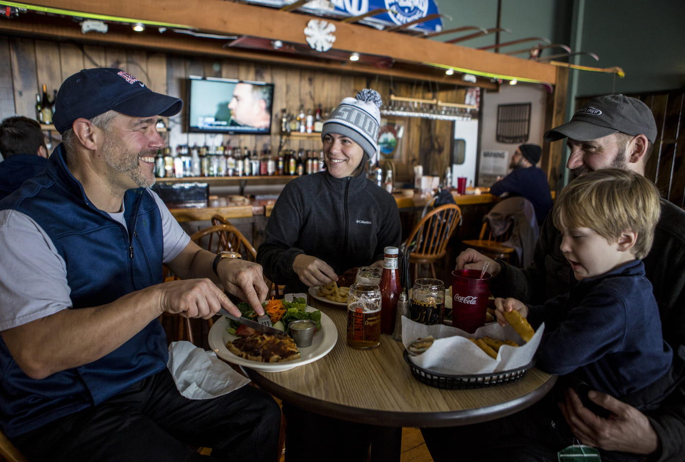 Oak Mountain in USA - a group of people sitting around a table eating food.