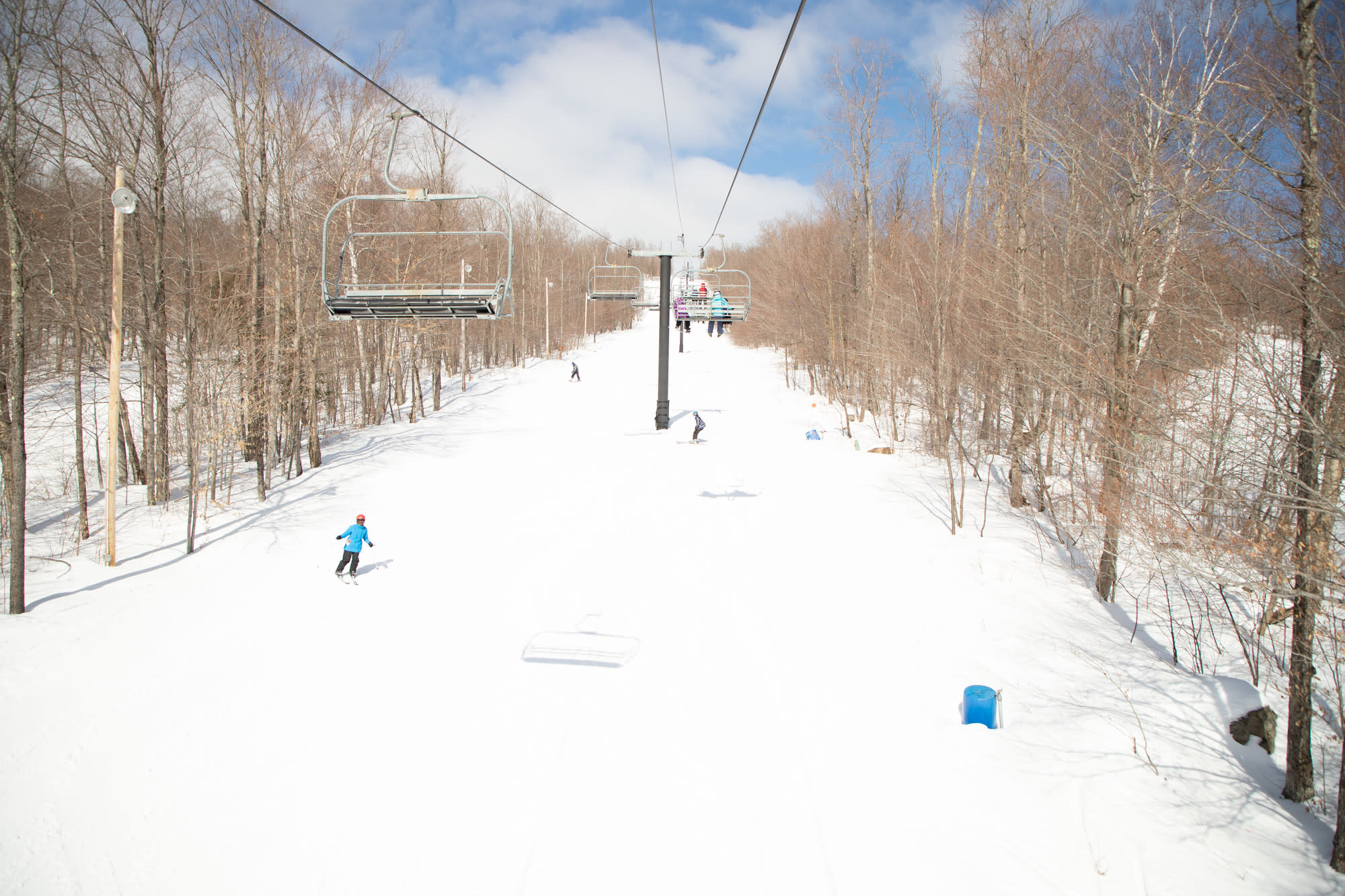 Oak Mountain in USA - a person riding a ski board down a snowy slope.