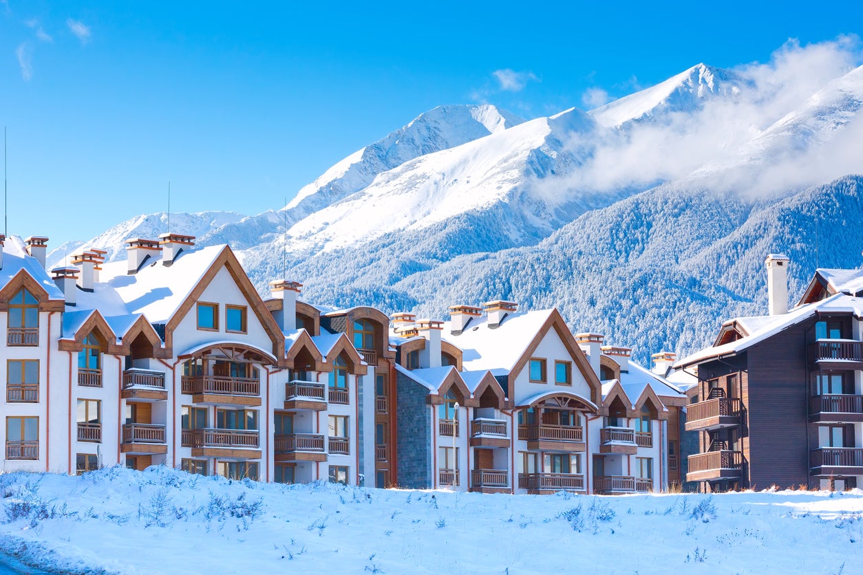 Bansko in Bulgaria - a row of houses covered in snow.