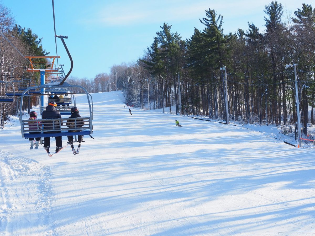 Mont Rigaud in Canada - a person on a ski lift going down a hill.