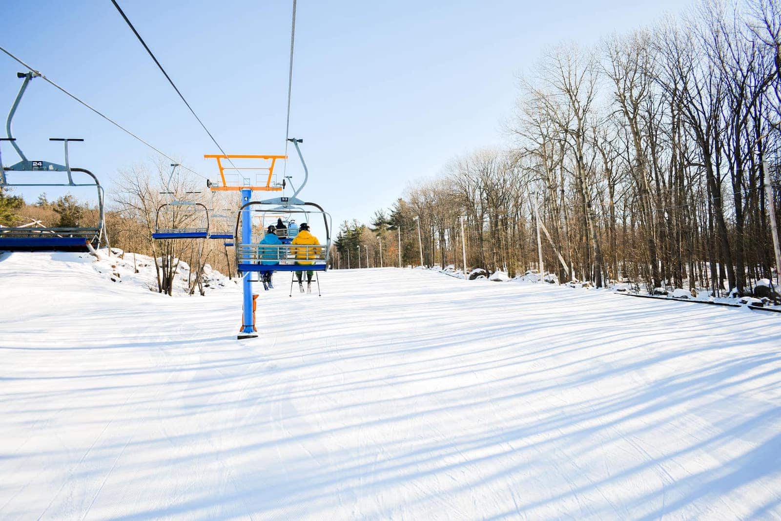 Mont Rigaud in Canada - a ski lift going up a snowy hill.