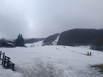 Image capturing a bustling ski resort in Monte Cusna, Villa Minozzo Reggio Emilia, Italy during the 2000 February. Beautiful mountain in the background completes the winter scene.