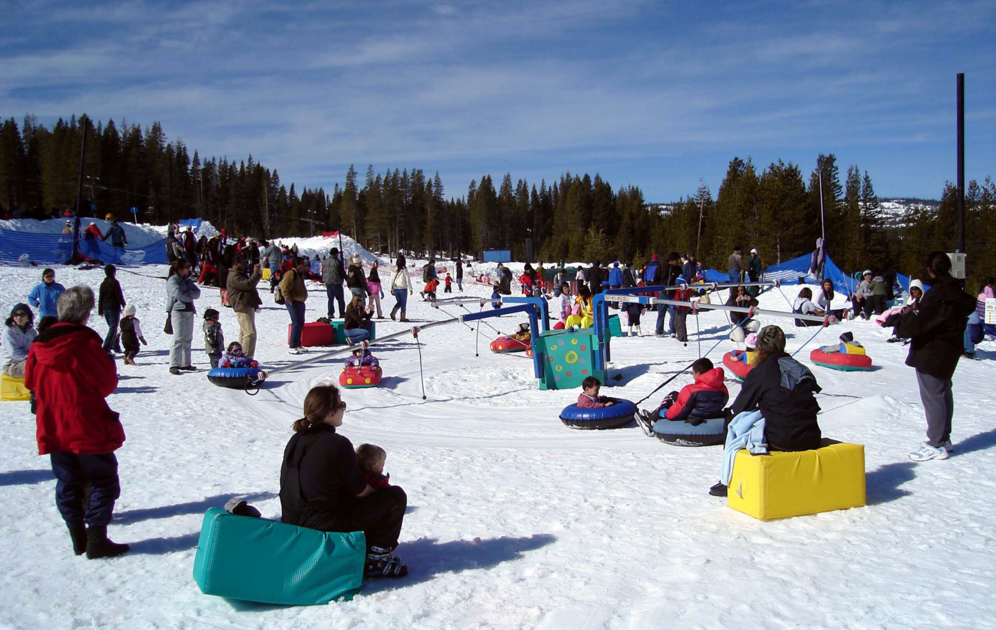 Soda Springs in USA - a group of people sitting in the snow.
