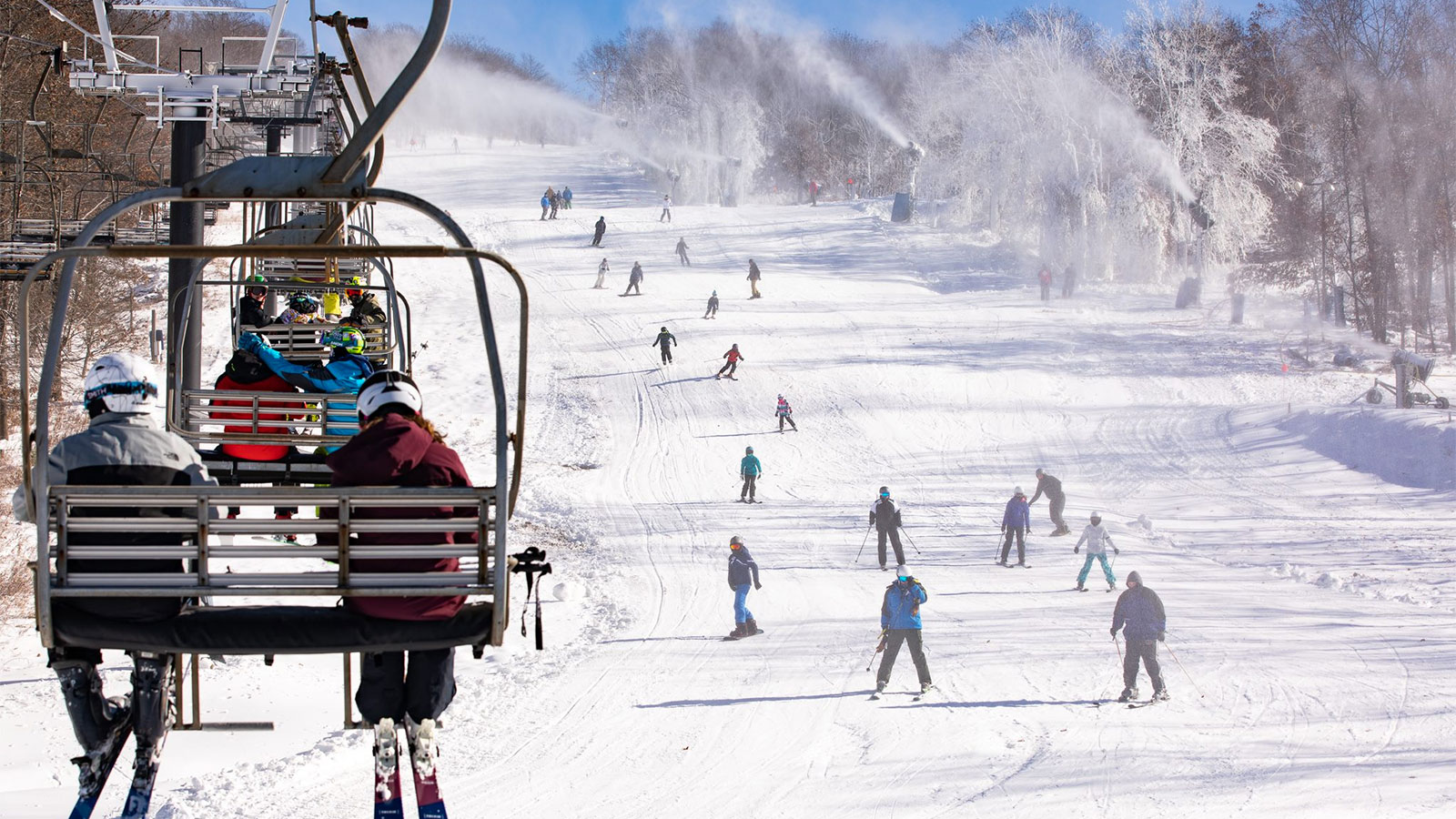Montage Mountain Resort in USA - a group of people riding a ski lift.
