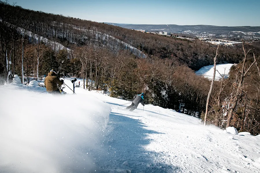Montage Mountain Resort in USA - a person riding a snowboard down a hill.