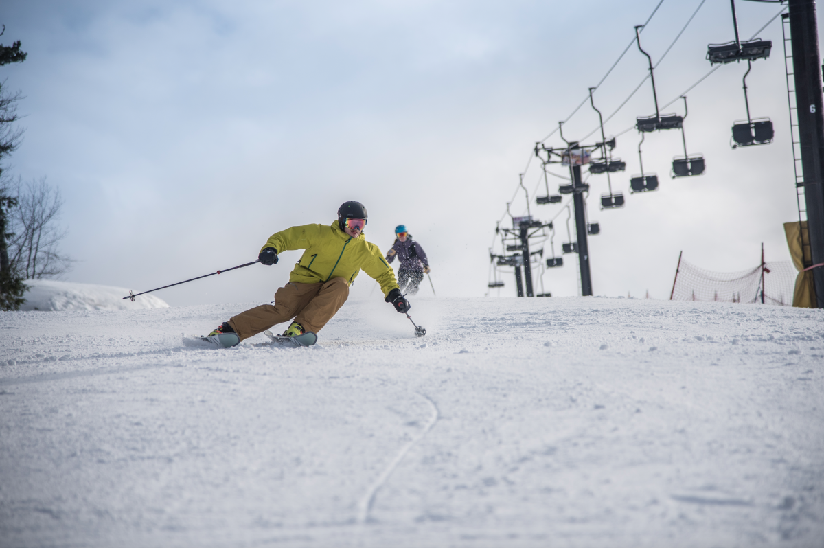 Marquette Mountain in USA - a person skiing down a snowy hill.