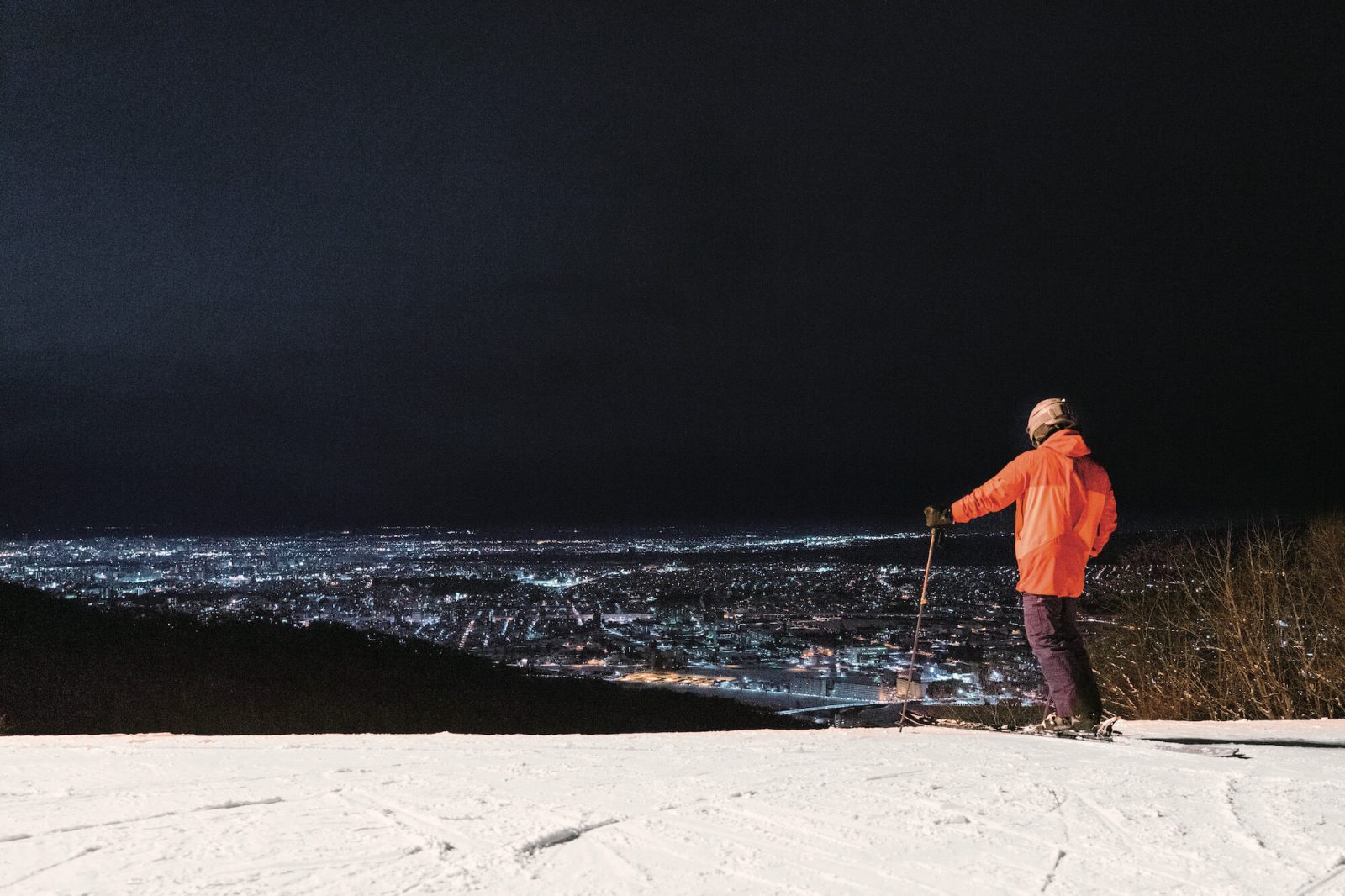 Moiwayama Ski Jominamishamen in Japan - a person standing on top of a snow covered hill.