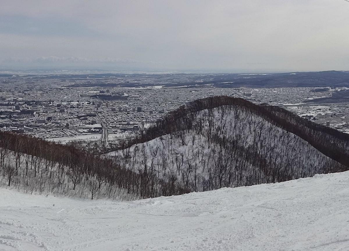 Moiwayama Ski Jominamishamen in Japan - a person on a snowboard on a snowy slope.