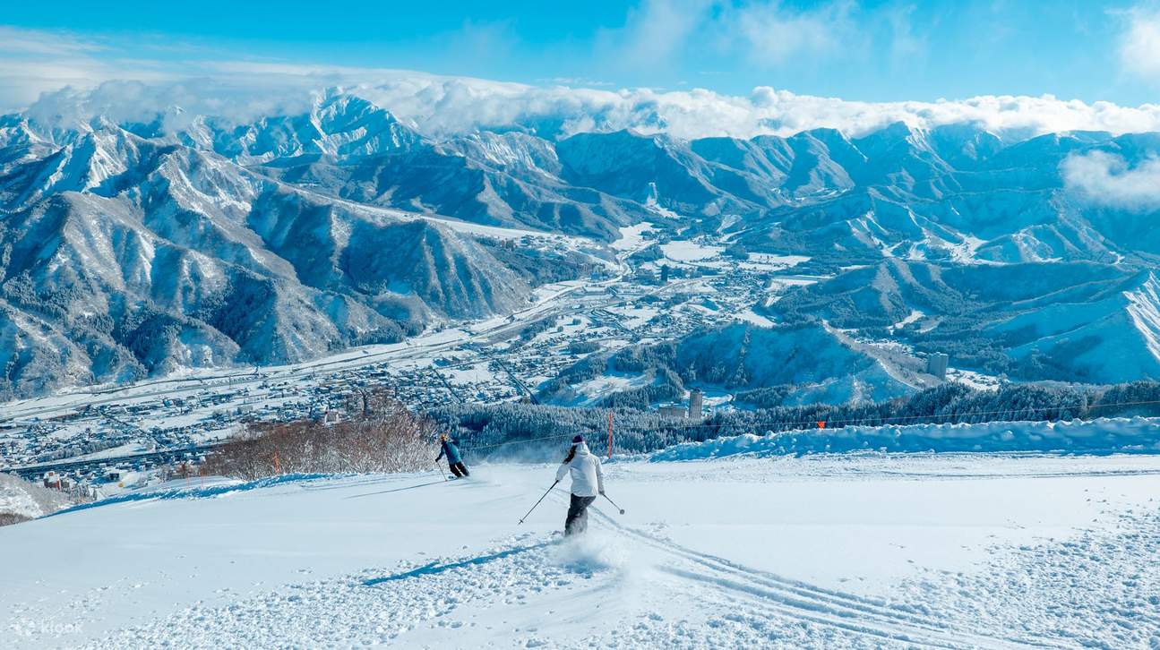 Chateau Shiozawa in Japan - skiers on the slopes of the mountain.