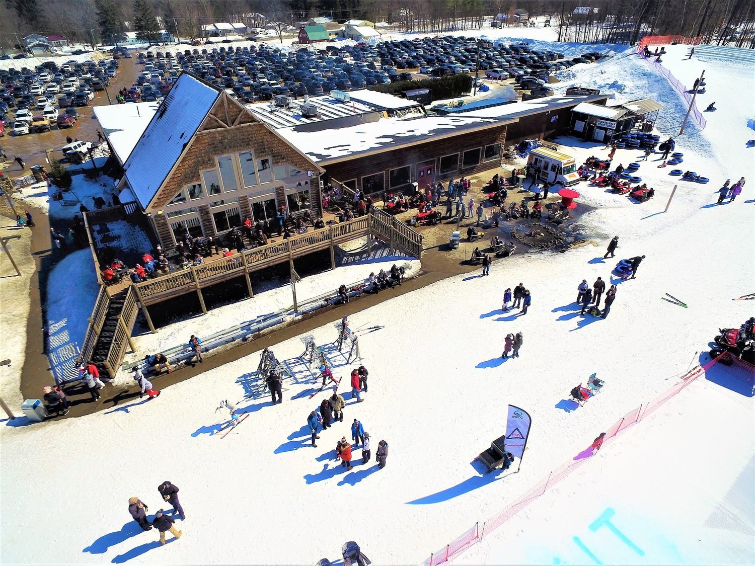 West Mountain in USA - a group of people standing on top of a ski slope.