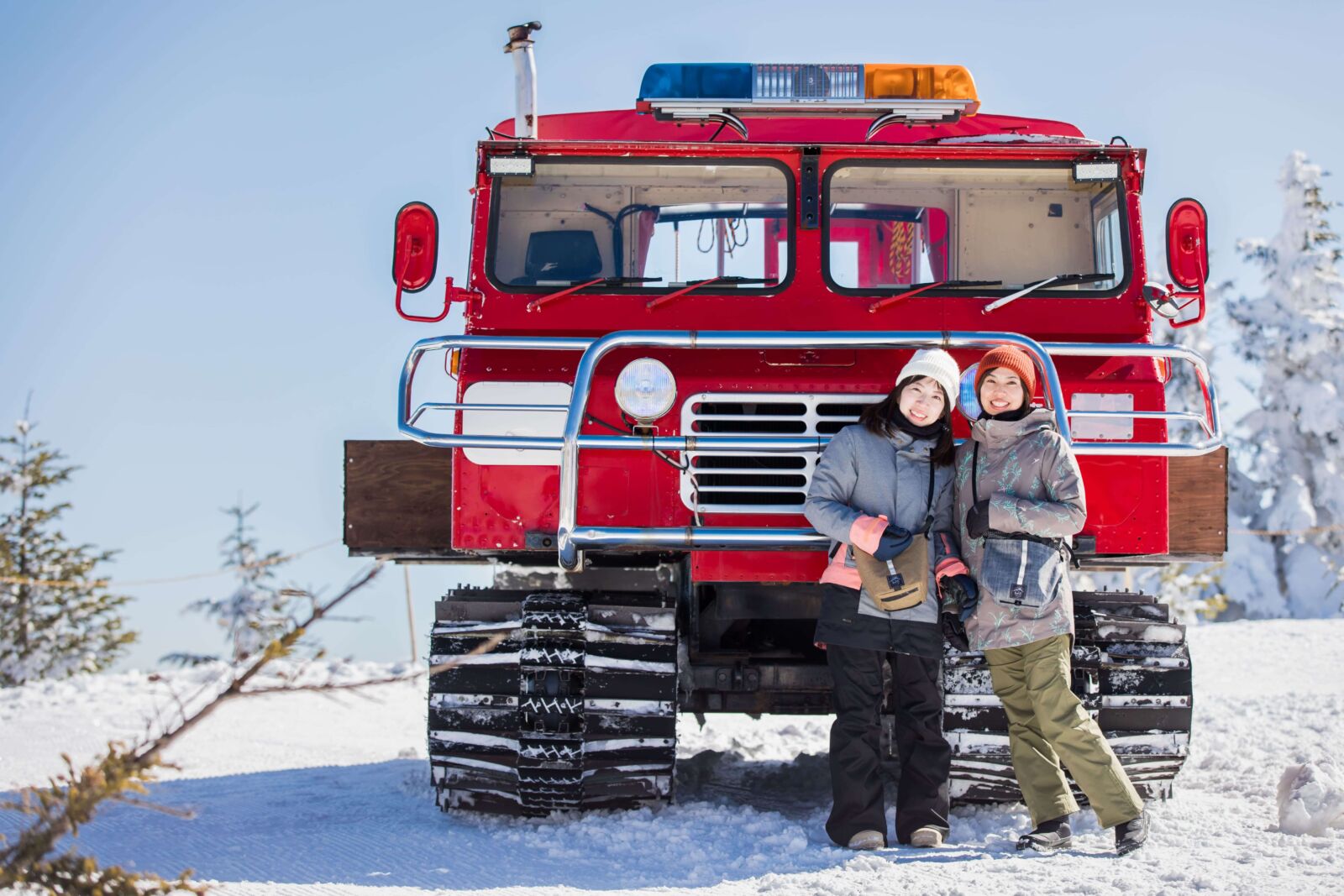 Pine Beak in Japan - a man and woman standing in front of a red truck.