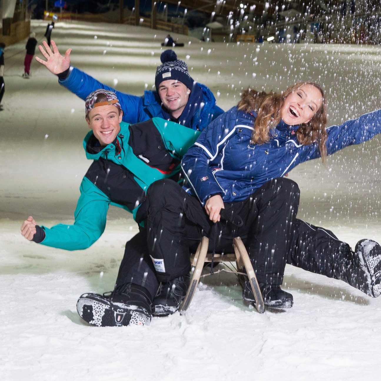 SnowWorld Terneuzen in Netherlands - two people sitting on a chair in the snow.