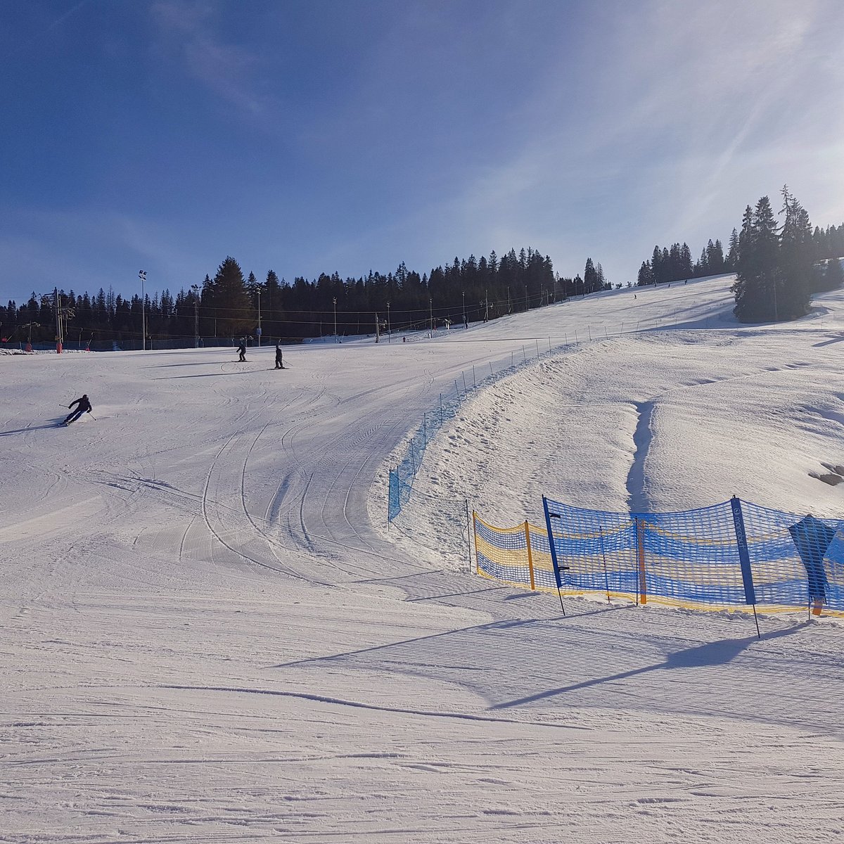 Hawrań – Jurgów in Poland - a person skiing down a snow covered hill.