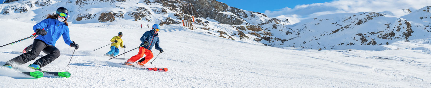 Alpe d'Huez in France - a group of people skiing down a snowy slope.