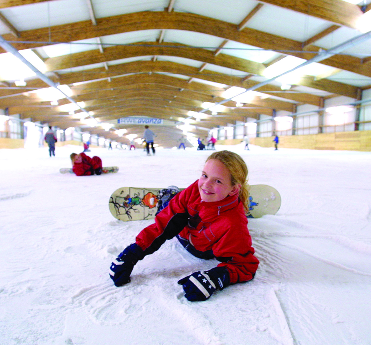 Bottrop in Germany - a little girl on a snowboard in the snow.