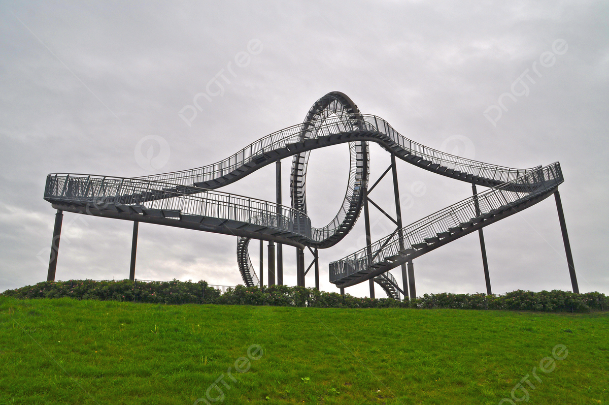Bottrop in Germany - a large metal structure on a grassy hill.
