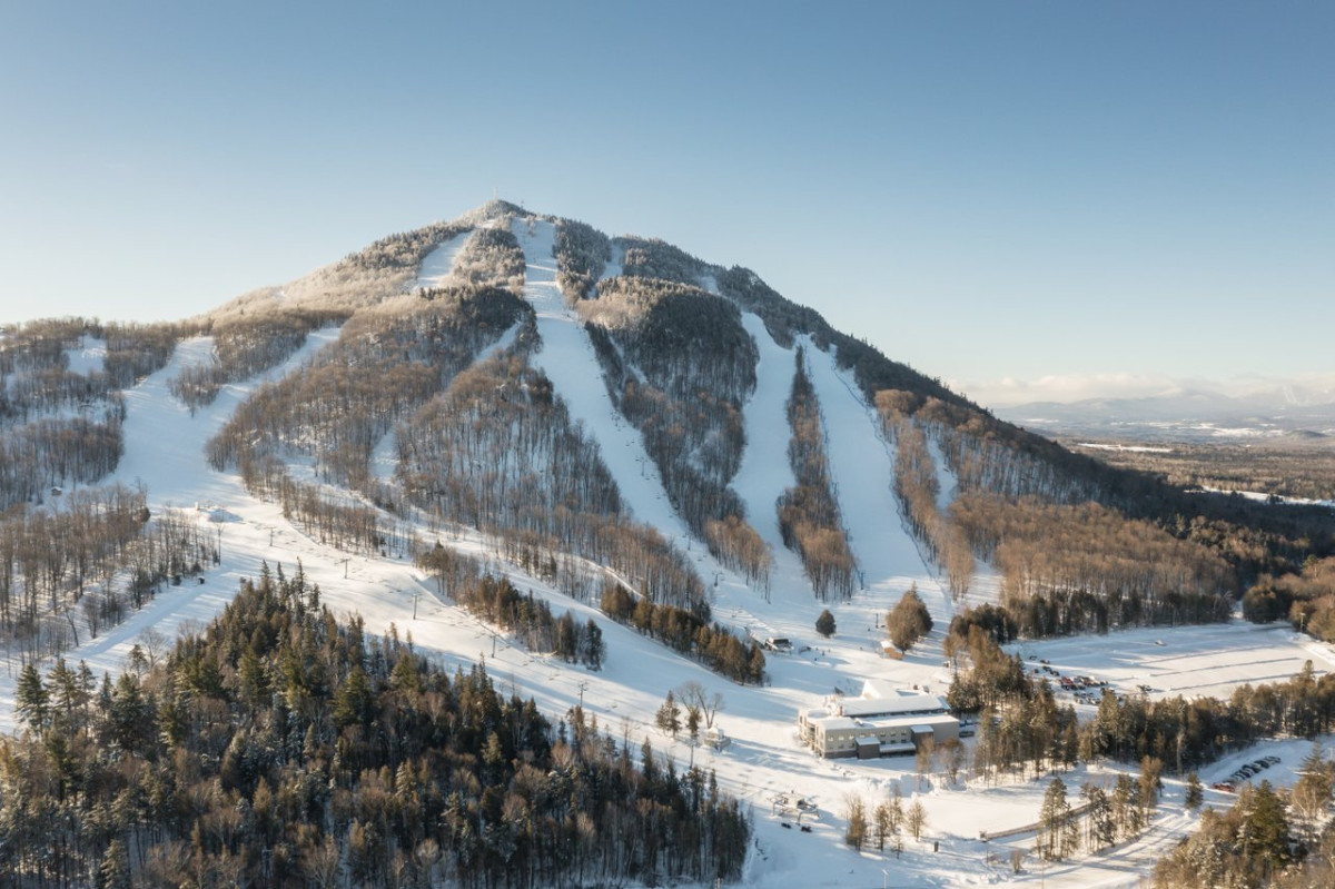 Mont Adstock in Canada - a snowy mountain with trees and snow on the ground.