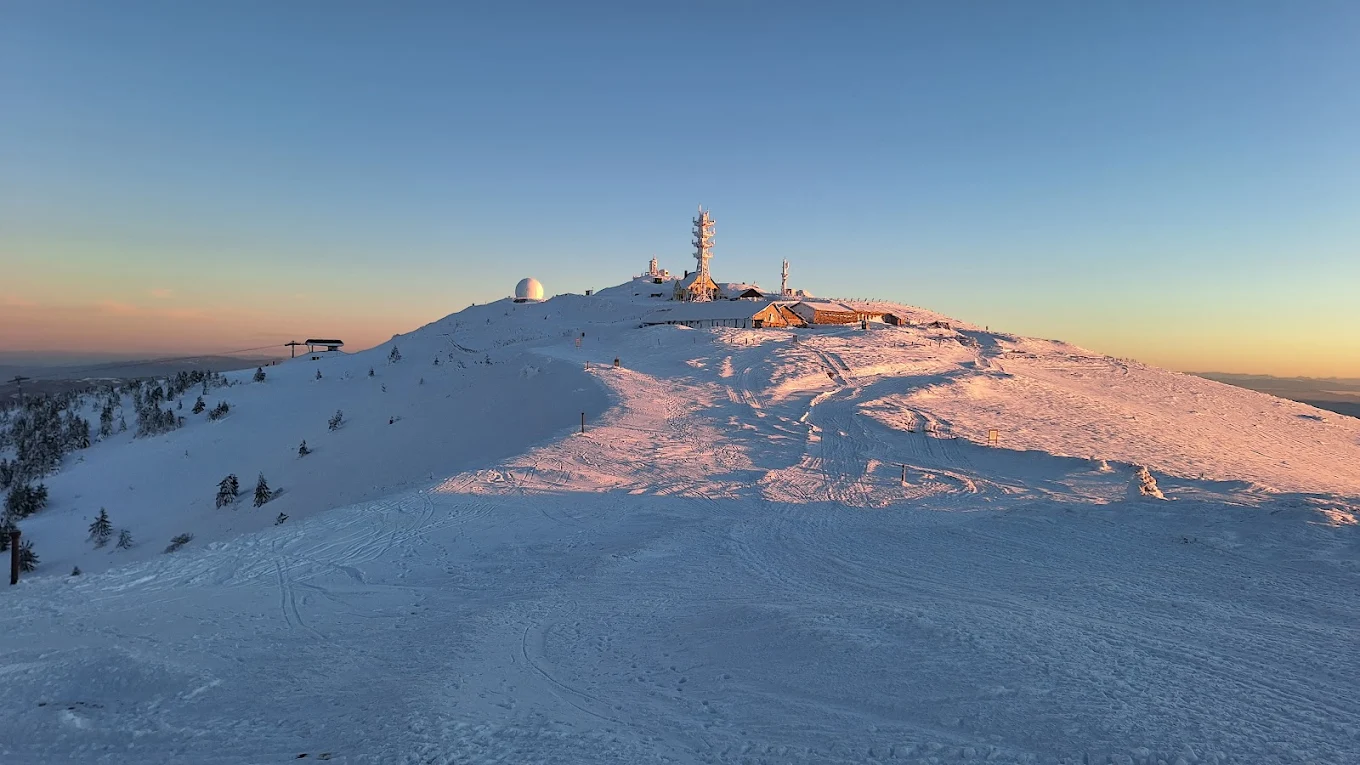 Kopaonik in Serbia - the summit of a mountain covered in snow.