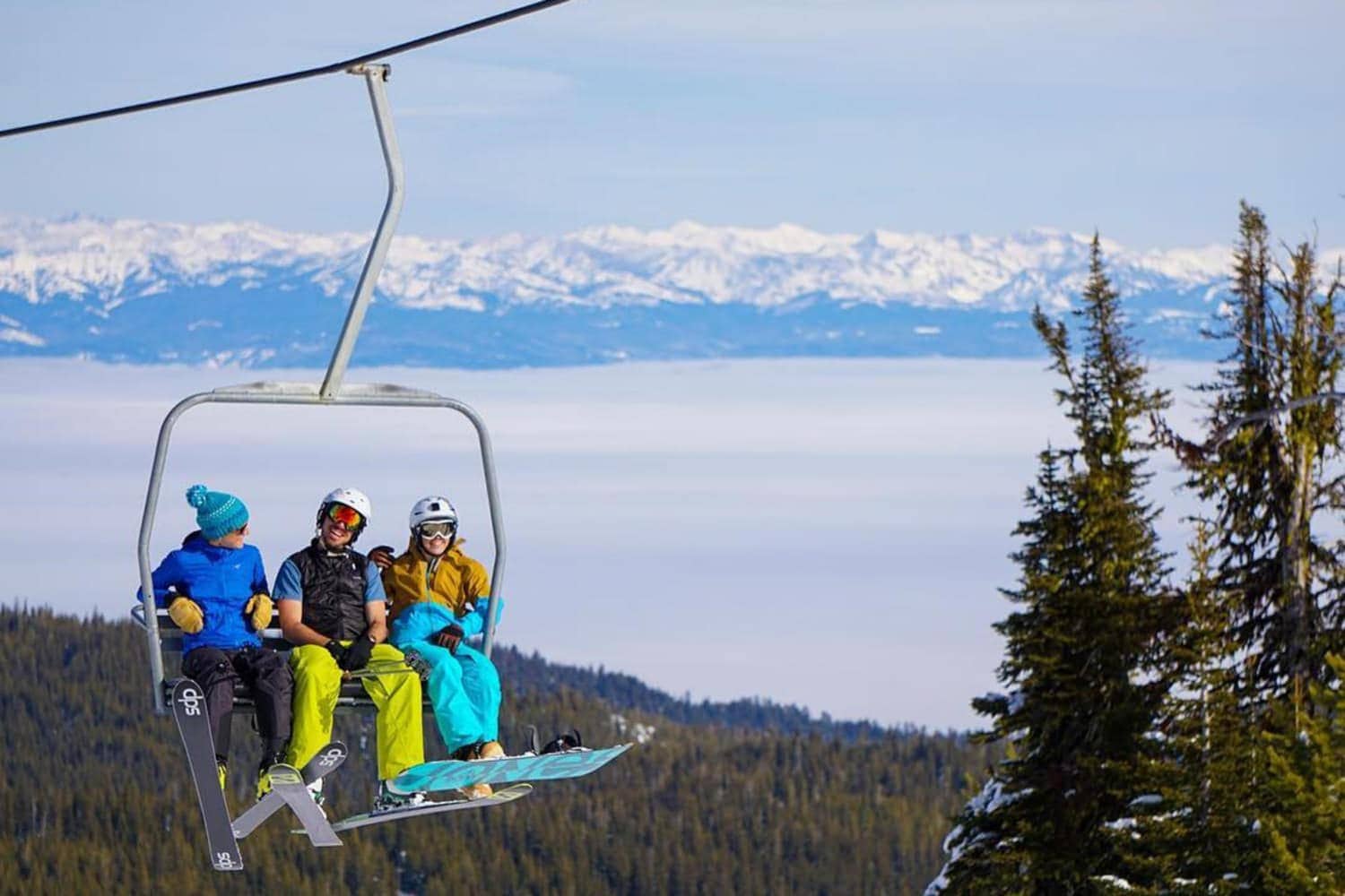 Anthony Lakes Mountain Resort in USA - a group of people riding a ski lift.