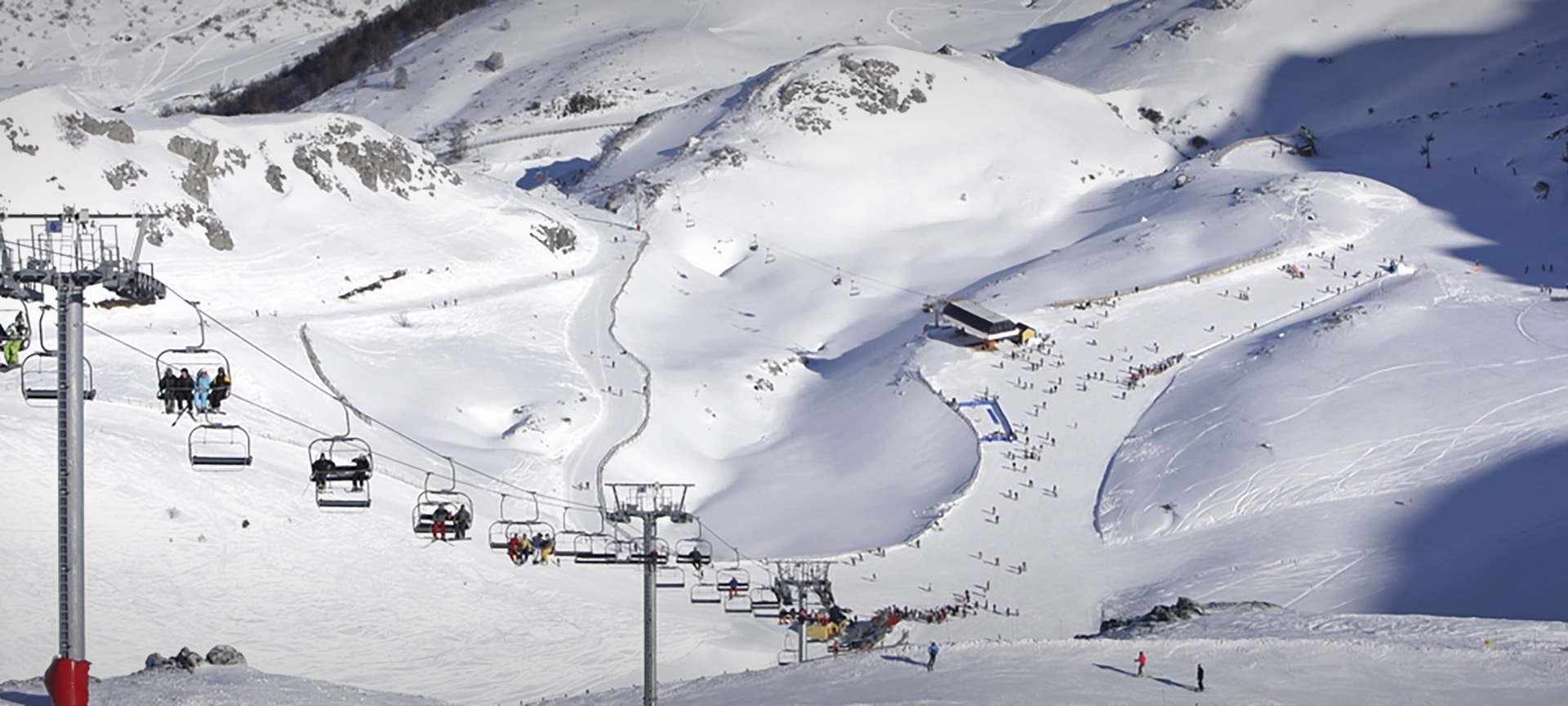 Fuentes de Invierno in Spain - a ski lift going up a snowy mountain.