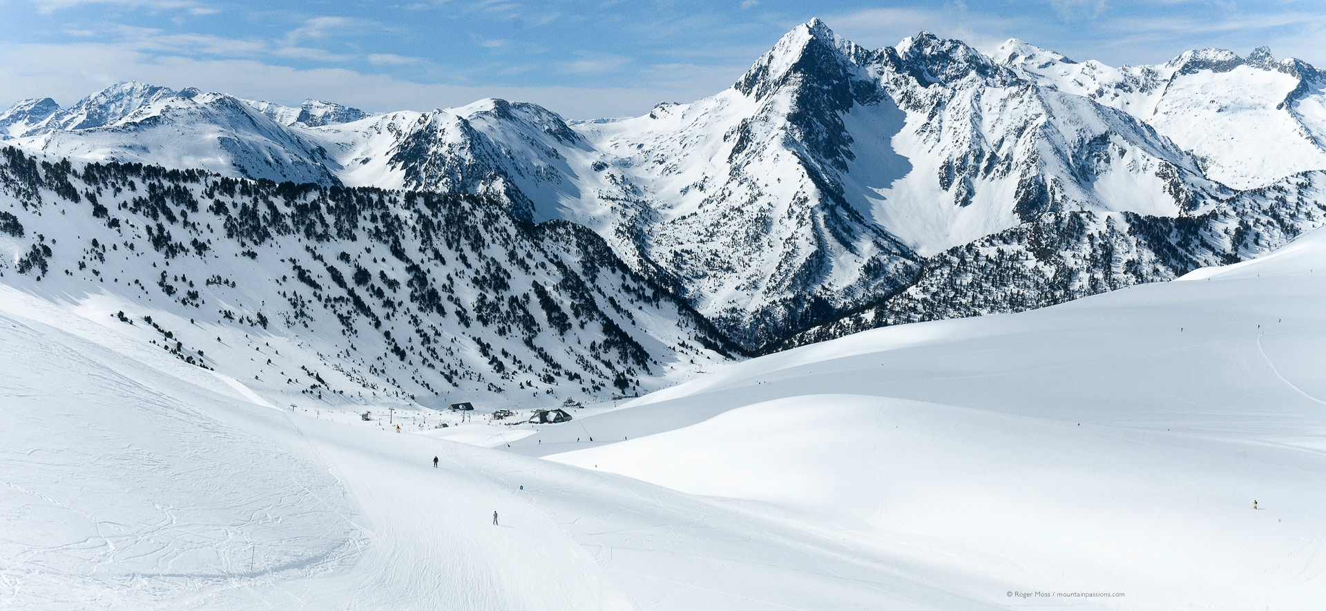 Saint-Lary-Soulan in France - a person skiing down a snow covered mountain.