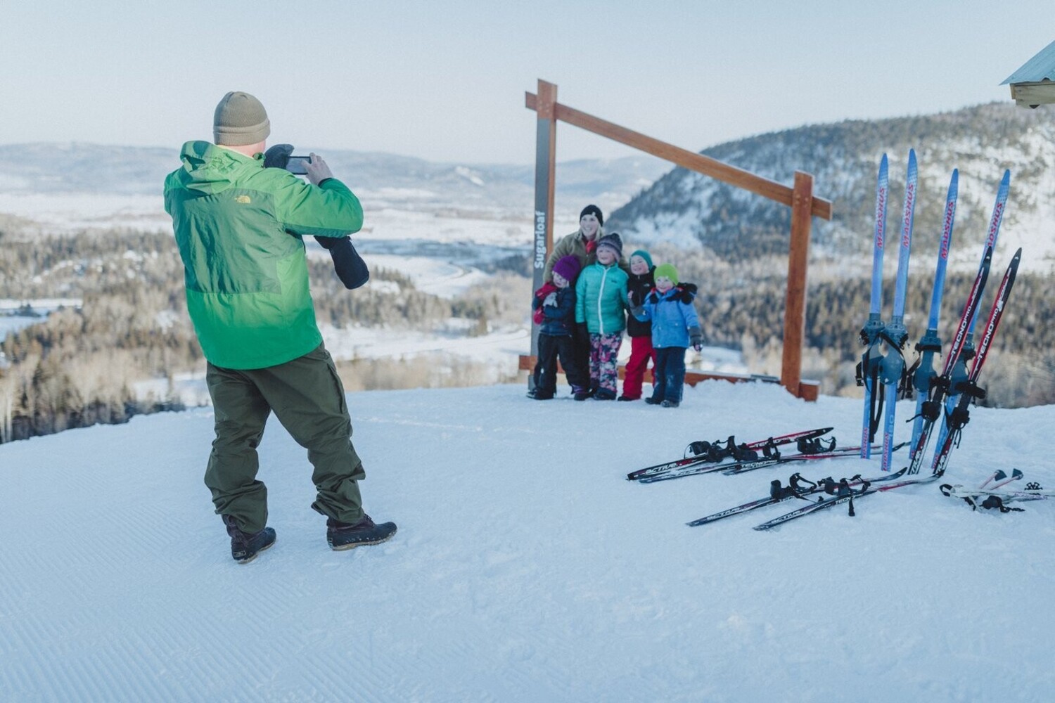 Sugarloaf Provincial Park in Canada - a group of people standing on top of a snow covered slope.