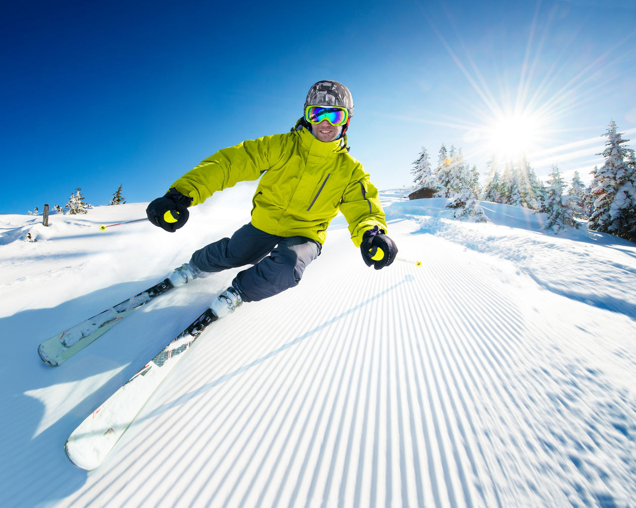 Etna Sud, Nicolosi in Italy - a man riding a snowboard down a snow covered slope.