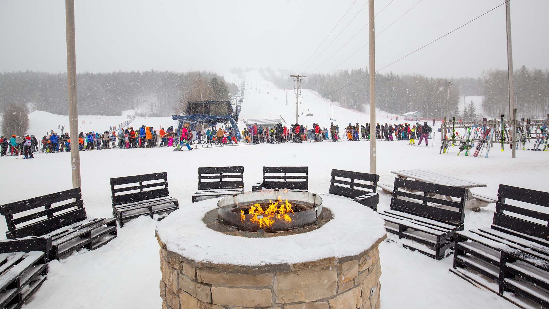 Wentworth in Canada - a group of people standing around a fire pit.