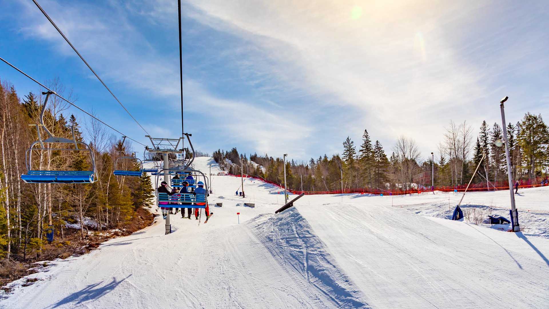 Wentworth in Canada - a ski lift going up a snowy hill.