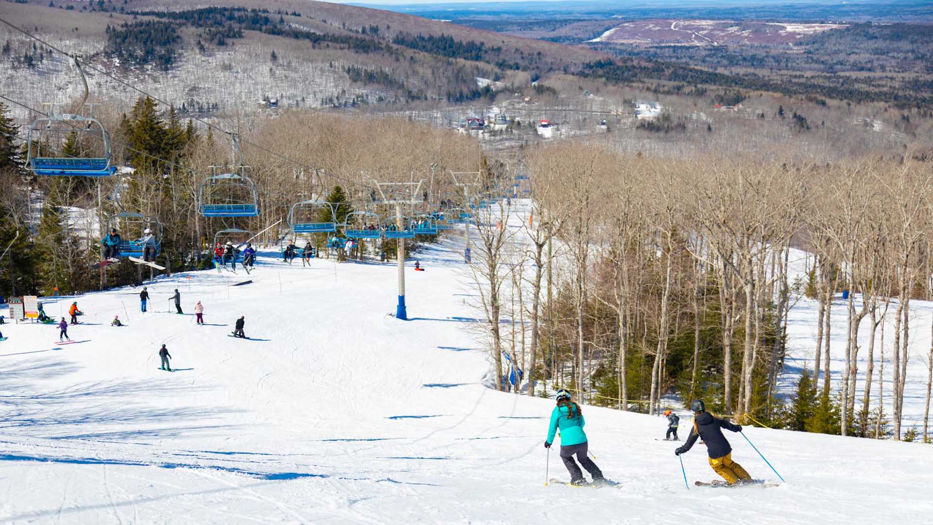 Wentworth in Canada - a group of people skiing down a mountain.