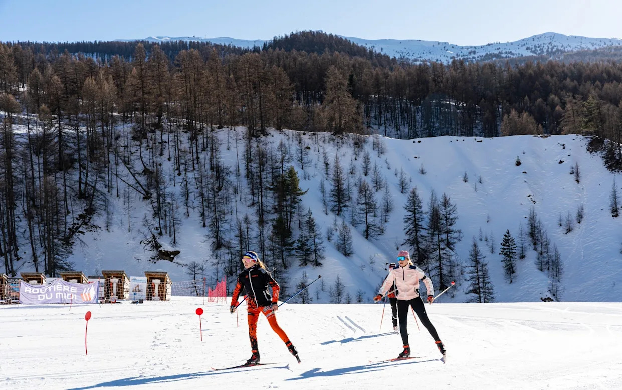 Crévoux in France - two people are skiing down a snowy slope.
