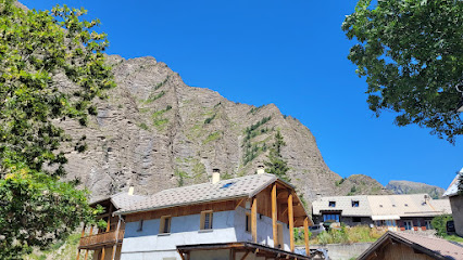 A picturesque view of Crévoux France. Dotted with a charming chalet lodge and mountain hut the snow-covered mountains make it an ideal ski resort. A perfect blend of rustic charm and winter sport.