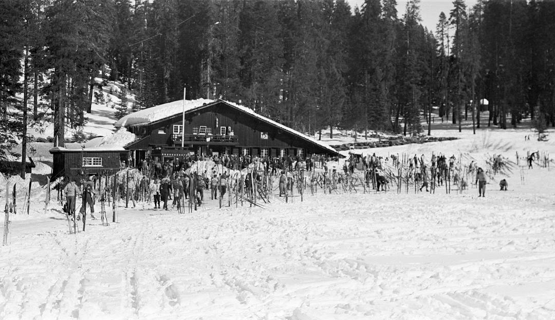 Badger Pass in USA - a black and white photo of people skiing in the snow.